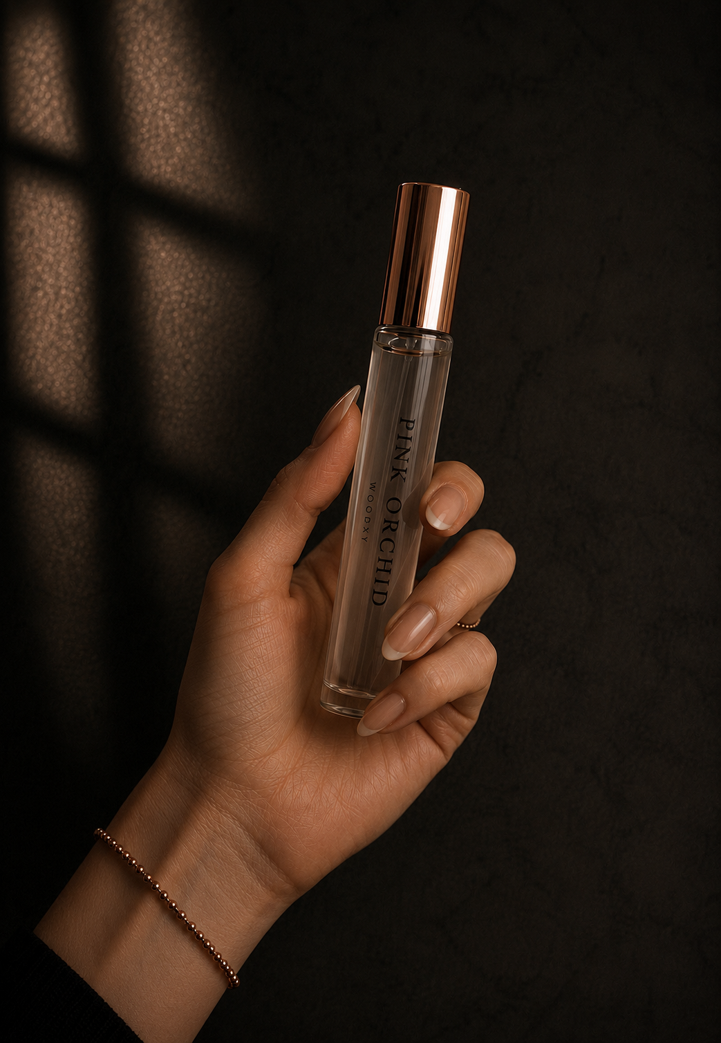 Woman holding Pink Orchid Roll-On Perfume