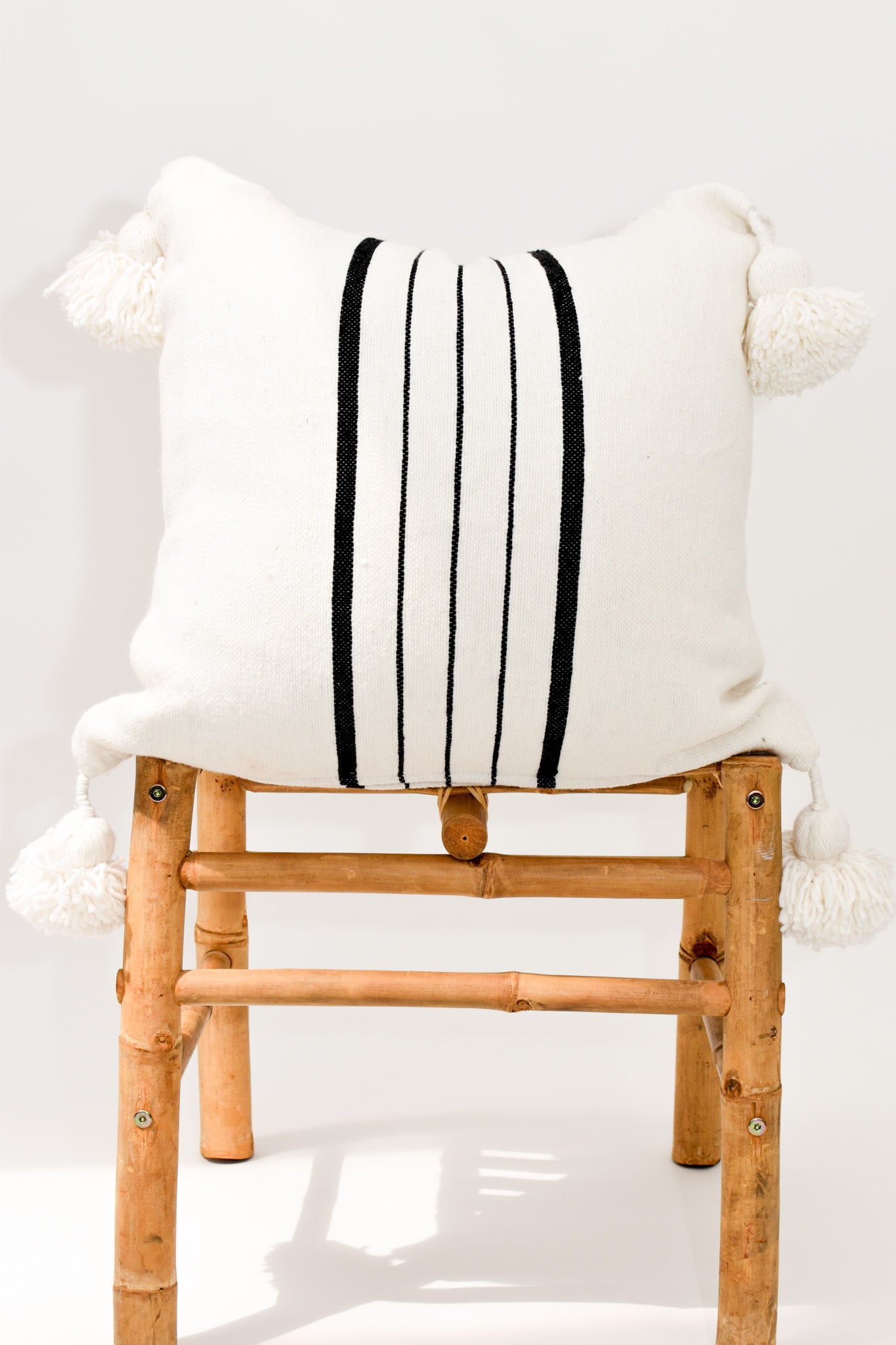 Handwoven Pom Pillow - White with Black Stripes and White Poms
